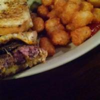 The Manny Melt Burger · Ground sirloin burger melted cheddar cheese crisp bacon, sauteed mushrooms and onions on gri...