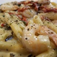 Shrimp Genovese · Served with mushrooms, shallots, sun dried tomatoes in brandy creamy sauce and touch of lemo...
