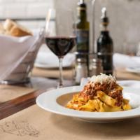 Tagliatelle Bolognese · House-made tagliatelle with classic Bolognese sauce