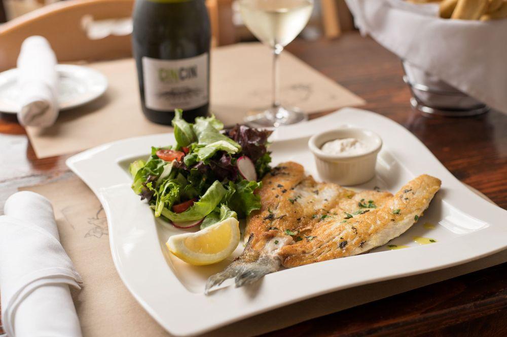 Branzino · Broiled butterfly branzino served with mixed greens and tartar sauce