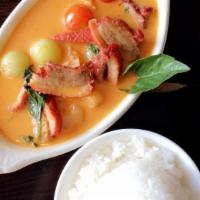 Red Curry · Cooked in red curry with pineapple, tomatoes and grapes. Spicy.