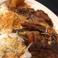 Lamb Mandi · Slow oven roasted lamb in imported yemeni still seasoning served with rice and topped with m...