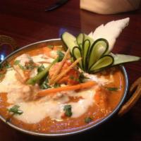 Tikka Masala · Cream of tomato sauce with herbs and spices. Served with steamed Basmati rice. Gluten free.
