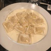Pear Ravioli · Ravioli stuffed with pears and Gorgonzola in a creamy sauce with a touch of truffle oil.