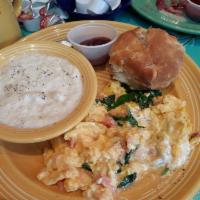 Smoked Salmon Scramble · Three eggs scrambled with chopped wood-smoked salmon and dill cream cheese, served with a ch...