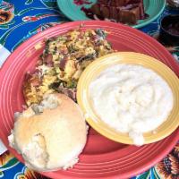Southern Scramble · Three eggs scrambled with choice of bacon, spicy vegan collard greens, onions, and yellow ch...