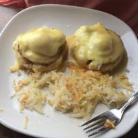 Eggs Benedict · 2 poached eggs with Canadian bacon on a toasted English muffin, topped with hollandaise sauc...