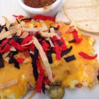 Migas · Scrambled eggs, tortilla strips, jalapenos, tomatoes, and onions, topped with aged cheddar. ...