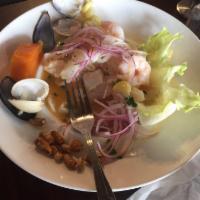 Ceviche Mixto · Fish, calamari and shrimp fresh mixed, seafood (clams, mussels, squid and shrimp) marinated ...