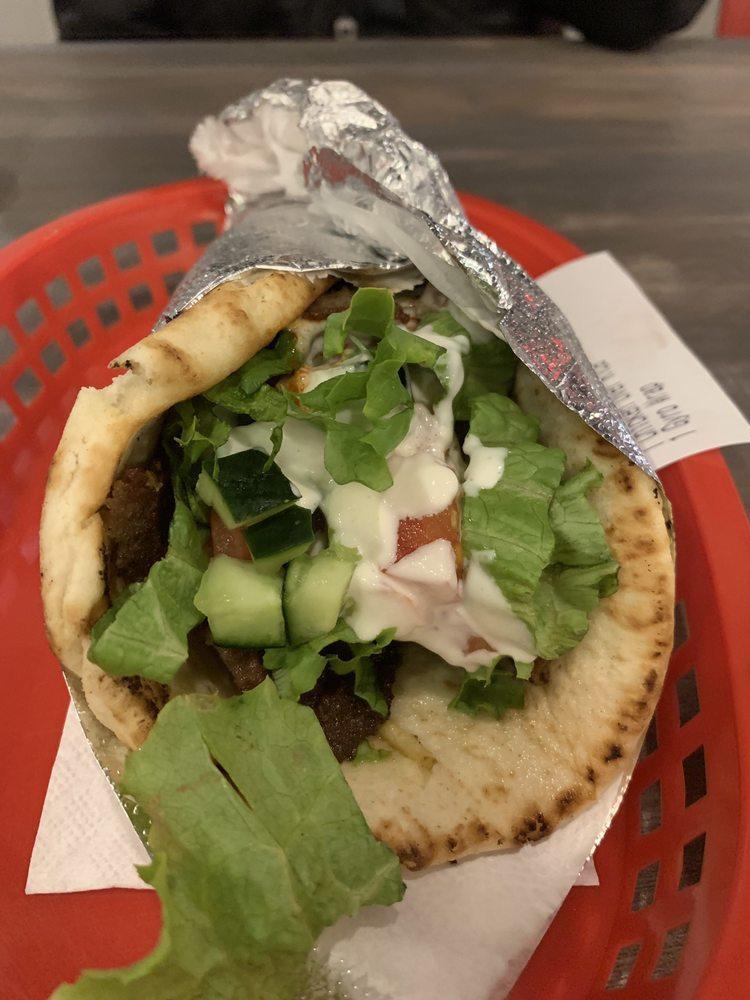 Gyro Wrap · Gyro with lettuce, tomato, cucumber, and our white sauce and hot sauce.