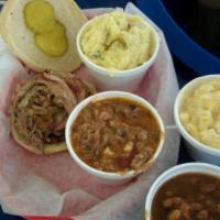Pulled Pork Sandwich · 1/3 lb. of smoked pulled pork topped with dill pickles and BBQ sauce on the side. Add extra ...