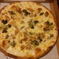Chicken Broccoli Alfredo Pizza · Comes with grilled chicken and broccoli. No red sauce.