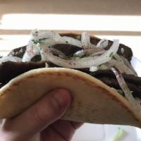 Gyro · Not halal. Mixed beef and lamb cooked on a grill served on pita bread, onion and tzatziki sa...