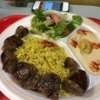 Lamb Kebab Platter · Includes rice, hummus, side salad and pita bread.