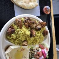 Chicken Kebab Platter · Includes rice, hummus, side salad and pita bread.