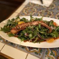 Octopus Salad · Confit octopus on a bed of arugula, fennel, red onion, and Roma tomato salad. Served with ho...