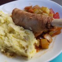 Lamb Shank · Comes with root vegetables & mashed Yukon gold mashed potatoes.