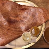 Mysore Masala Dosa · Crepe spread with spicy chutney and spiced mashed potatoes.