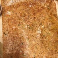 Onion Rava Masala Dosa · Spiced potatoes and onions wrapped in a crepe made from semolina, sprinkled cumin seeds, gin...