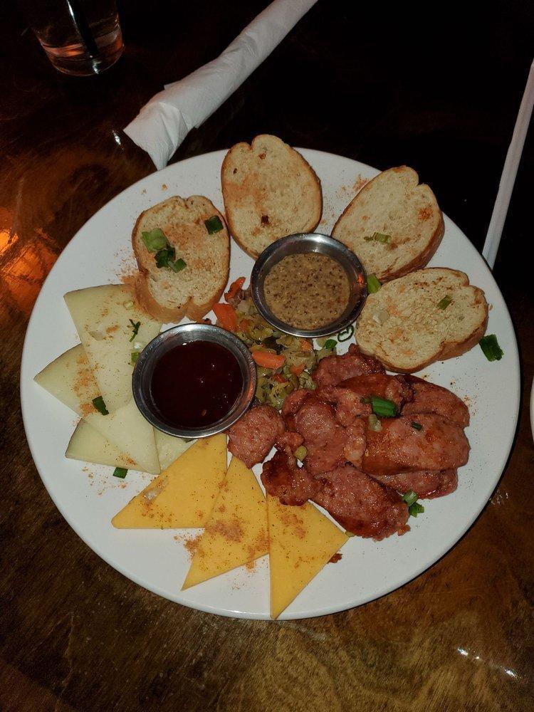 Alligator Sausage and Cheese Plate · Choice of alligator or pork, pickled vegetable, cracker bread with beer mustard sauce.