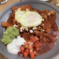 Chilaquiles · Baked tortillas, guajillo chile salsa, feta cheese, pickled onions, guacamole, pico de gallo...