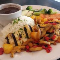 Tropical Chicken Grilled · Chicken breast finished with sautéed onions,
mushrooms and pineapple. Served with white rice...