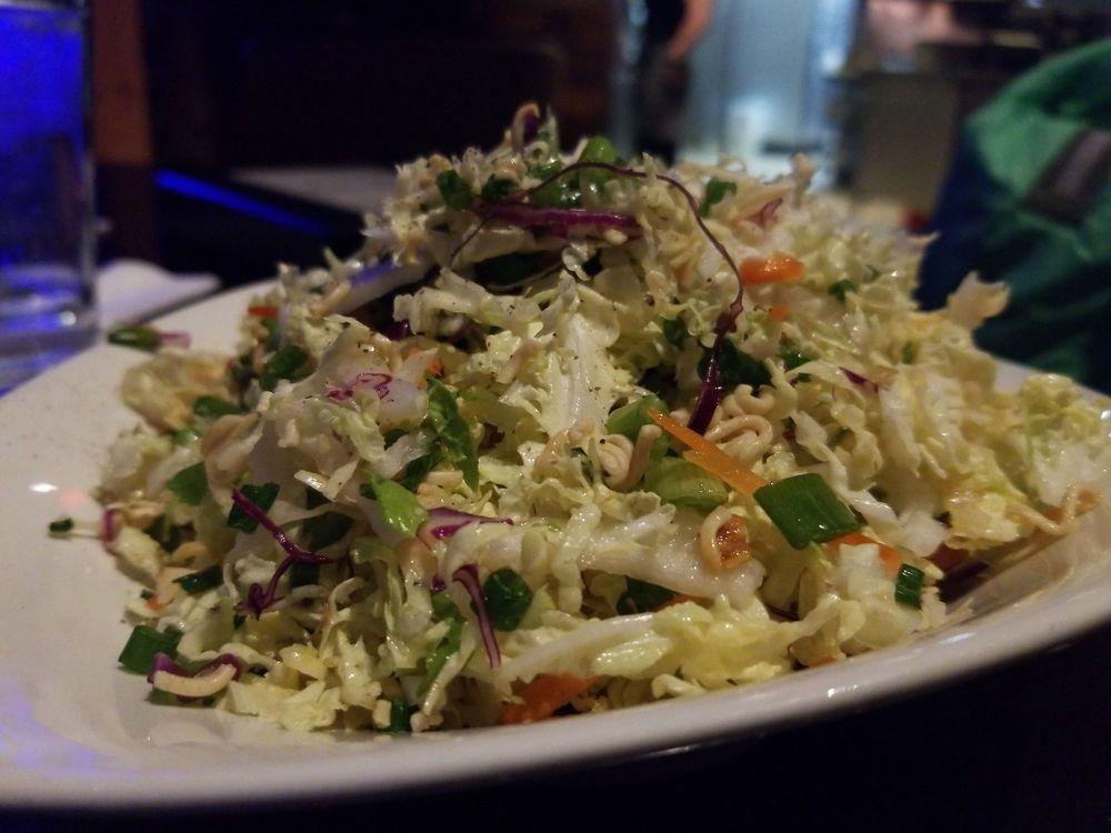 Oriental Salad · Napa & red cabbage, green onions, cilantro, carrots, bell peppers, almond ramen crunch, sweet-soy dressing.