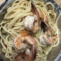 Shrimp Scampi · Spaghetti pasta with sautéed shrimp in a rich white wine garlic butter sauce.