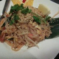 Pad Thai · Rice noodles sauteed in a Thai sweet, and sour sauce with jumbo shrimp, spring onions, bean ...