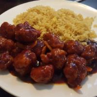 Orange Chicken · Chunks of crispy chicken cooked with tangerine peel in a spicy sauce.