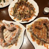 Volcano Roll · Deep fried shrimp, crab meat salad and tempura bits. Spicy.