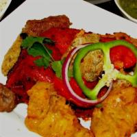 Tandoori Mixed Grill · A sizzling combination of all of our tandoori specials including tandoori chicken, chicken t...