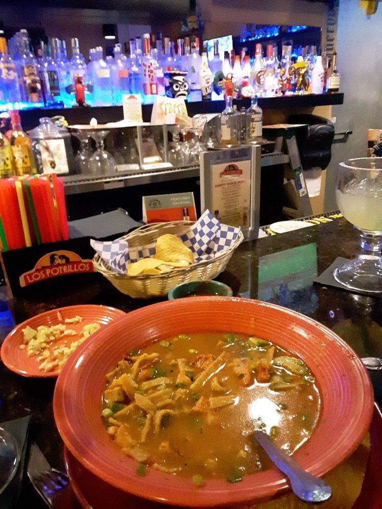 Chicken Tortilla Soup · An authentic Mexican soup made with grilled chicken, chicken broth, corn tortilla, tomato, green onions, avocado and cheese.