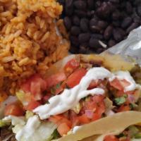 2 Tacos Platter · Our delicious tacos served with our homemade rice and beans.