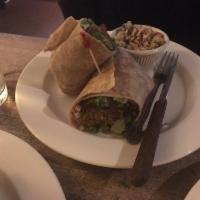 Falafel Wrap · Baked falafel, romaine, tomato, cucumber, red onion, garlic spread, and whole wheat wrap. Ve...