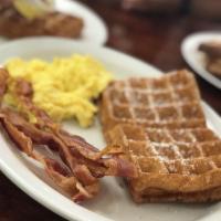 Waffle Combo Breakfast · Served with 2 eggs and choice of 4 pieces bacon or 4 sausage link.