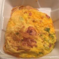 Western Omelette · Our fluffy omelette filled with diced Hillshire sugar cured ham, red and green bell peppers,...