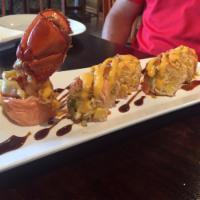 Fuji Roll · Lobster tempura, crab salad and tamago avocado wrapped in soy paper with eel sauce and spicy...