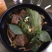 Beef Stew Noodle Soup · Beef noodle soup with onions, basil leaves, scallions, bean sprouts, celery and cilantro.