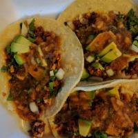 Vegan Breakfast Tacos · 3 tacos stuffed with soyrizo and tofu, topped with avocado, cilantro, onions, salsa, and bla...