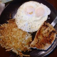 Pork Chops · 2 eggs and juicy pork chops. Served with choice of side and toast.