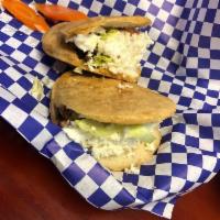 2 Gorditas · Filled with your choice of meat, lettuce, tomato, Cotija cheese crumbles, sour cream and ser...