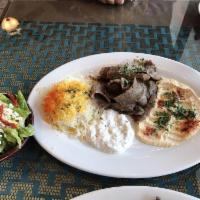 Gyro Plate · Vertically grilled beef and lamb, sliced thinly. Served with hummus, tzatziki sauce and Gree...