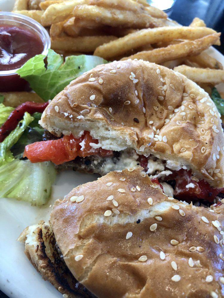 Greek Burger · Fresh ground beef with feta cheese, roasted garlic, sun-dried tomatoes, roasted bell peppers, and Greek olives.