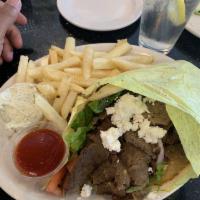 Gyro and Feta Sandwich · Classic gyro with lamb, beef, feta, and side of tzatziki sauce.