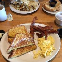 French Toast Combo · French toast served with two eggs any style and your choice of 4 strips of bacon or 2 sausag...