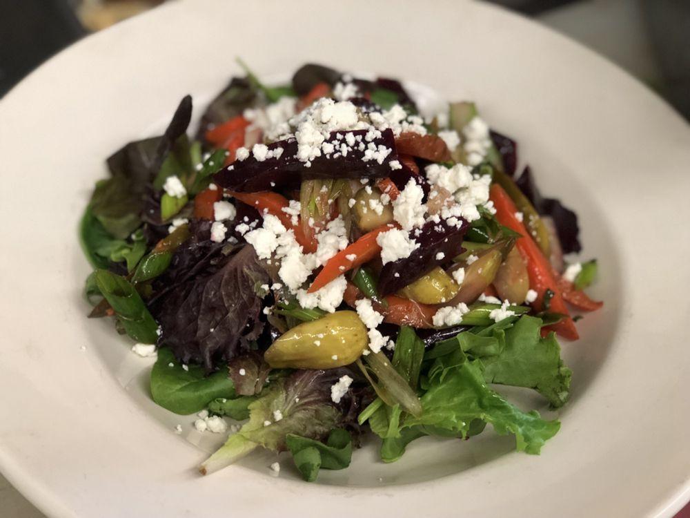 Bello Salad · Baby spinach, roasted portobello, roasted artichokes, roasted peppers and goat cheese.