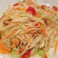 Papaya Salad · Fresh green papaya, tomato, peanuts, shrimp, hot chili and Thai chili lime vinaigrette.