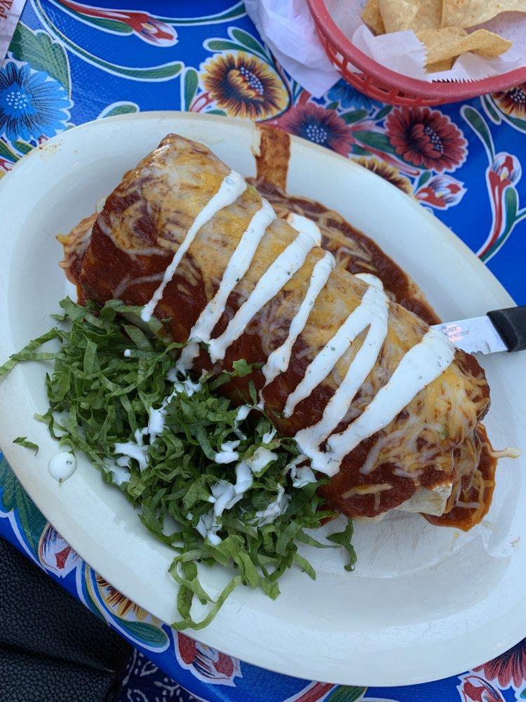 Wet Burrito · Our corazón burrito smothered in red enchilada sauce, melted cheddar Jack cheese, and lime cilantro crema. Substitute shrimp for an additional charge.