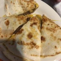 Quesadilla · 12 inch flour tortilla with melted cheddar Jack cheese with meat or vegetarian option for an...